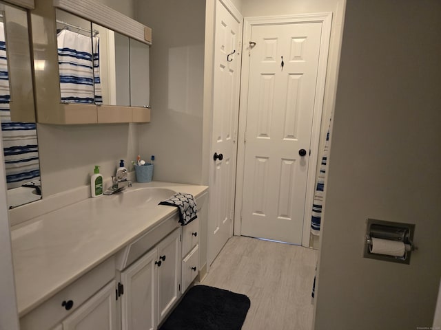 bathroom featuring vanity and wood finished floors