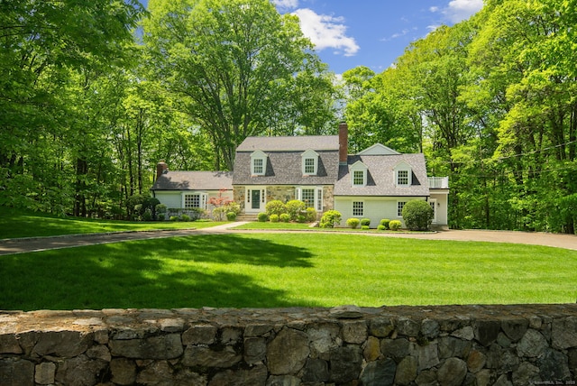 5 Dorr Rd, Darien, CT 06820 - colonial inspired home with a chimney, a front lawn, driveway, and stone siding