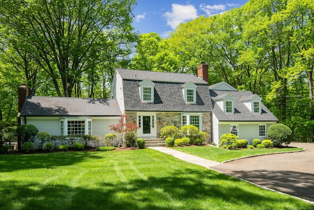 5 Dorr Rd, Darien, CT 06820 - dutch colonial featuring a chimney, a front yard, stone siding, and roof with shingles