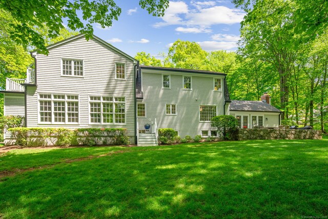 5 Dorr Rd, Darien, CT 06820 - back of property featuring a lawn and a chimney