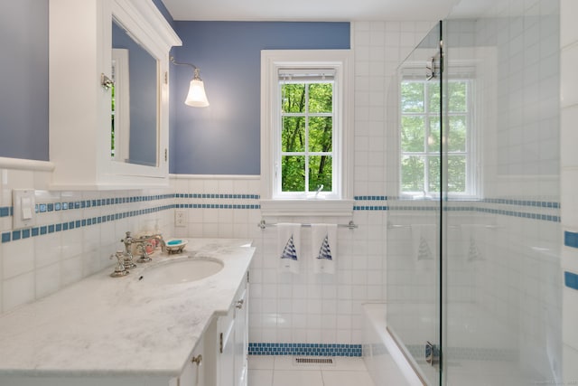 5 Dorr Rd, Darien, CT 06820 - full bath with tile patterned flooring, a tile shower, tile walls, vanity, and wainscoting