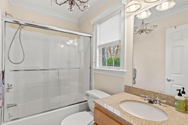 full bathroom with crown molding, vanity, toilet, a chandelier, and enclosed tub / shower combo