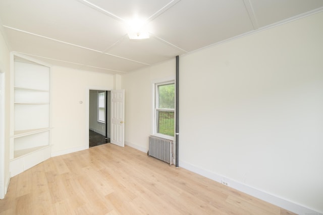 39 Tanner Ave, Norwich, CT 06360 - spare room with radiator heating unit, light wood-style flooring, and baseboards
