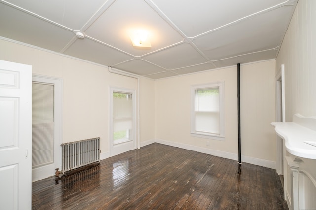39 Tanner Ave, Norwich, CT 06360 - interior space featuring radiator, multiple windows, hardwood / wood-style flooring, and baseboards