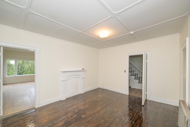 39 Tanner Ave, Norwich, CT 06360 - spare room with dark wood finished floors, baseboards, radiator, and stairs