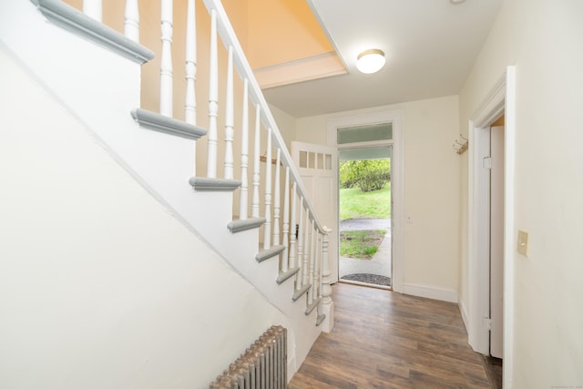 39 Tanner Ave, Norwich, CT 06360 - foyer entrance featuring radiator, wood finished floors, baseboards, and stairs