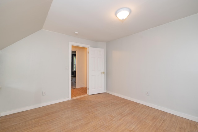 39 Tanner Ave, Norwich, CT 06360 - unfurnished room featuring light wood finished floors, baseboards, lofted ceiling, and a smoke detector