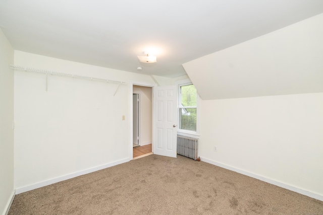 39 Tanner Ave, Norwich, CT 06360 - bonus room featuring radiator heating unit, carpet floors, baseboards, and lofted ceiling