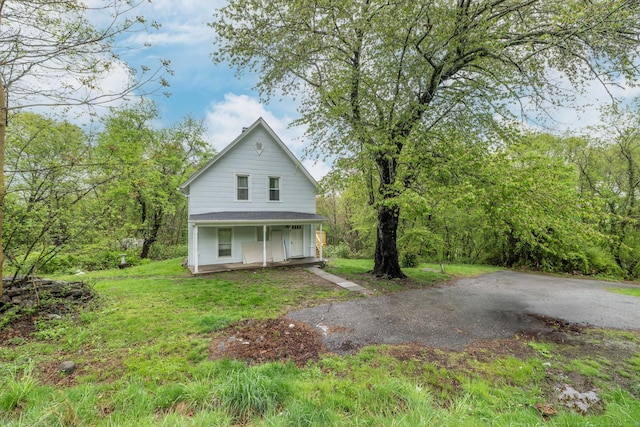 39 Tanner Ave, Norwich, CT 06360 - view of home's exterior featuring a porch and a yard
