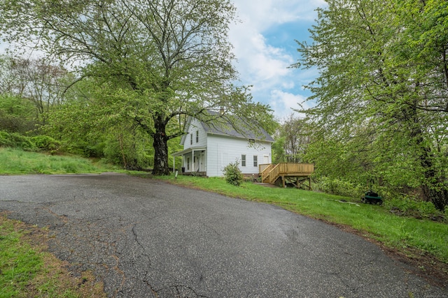 39 Tanner Ave, Norwich, CT 06360 - view of property exterior with a wooden deck and driveway