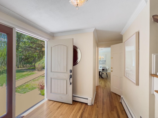34 Longmeadows Rd, Wilton, CT 06897 - foyer with ornamental molding, light wood-style flooring, and baseboard heating