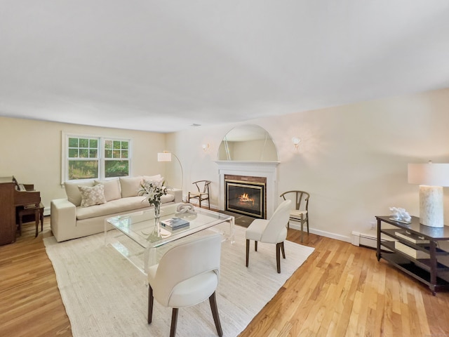 34 Longmeadows Rd, Wilton, CT 06897 - living room with light wood-style floors, a high end fireplace, a baseboard radiator, and baseboards