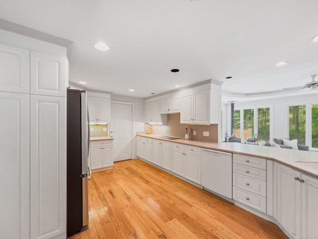34 Longmeadows Rd, Wilton, CT 06897 - kitchen featuring light wood-type flooring, freestanding refrigerator, dishwasher, and white cabinets
