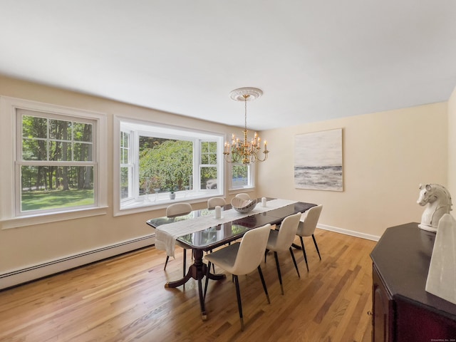 34 Longmeadows Rd, Wilton, CT 06897 - dining room with a chandelier, a baseboard heating unit, a wealth of natural light, and light wood finished floors