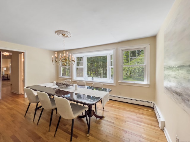34 Longmeadows Rd, Wilton, CT 06897 - dining room featuring a baseboard heating unit, light wood finished floors, a chandelier, and a wealth of natural light