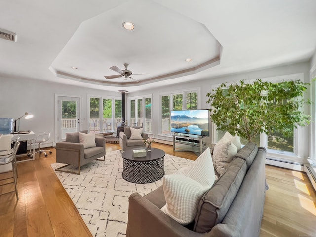 34 Longmeadows Rd, Wilton, CT 06897 - living room with a ceiling fan, visible vents, a raised ceiling, and light wood-style floors