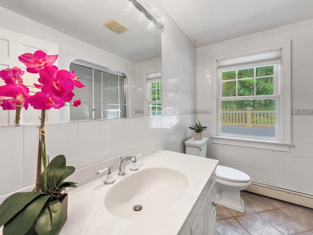34 Longmeadows Rd, Wilton, CT 06897 - bathroom featuring vanity, visible vents, toilet, tile walls, and a baseboard radiator