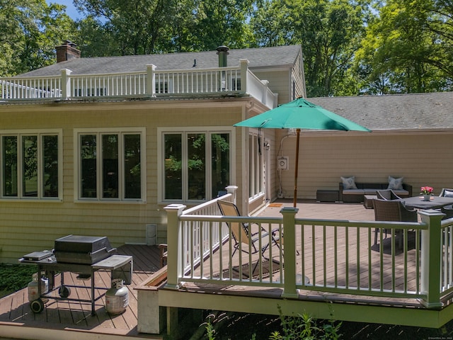 34 Longmeadows Rd, Wilton, CT 06897 - back of house with a wooden deck, a balcony, an outdoor hangout area, a chimney, and a shingled roof