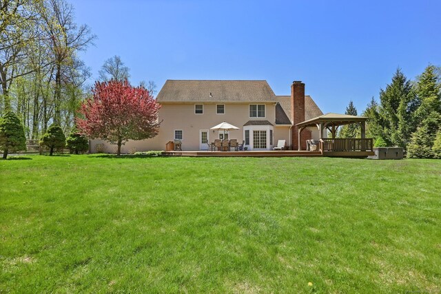 4 Walnut Ridge Rd, New Fairfield, CT 06812 - rear view of house featuring a yard, a gazebo, a chimney, and a deck