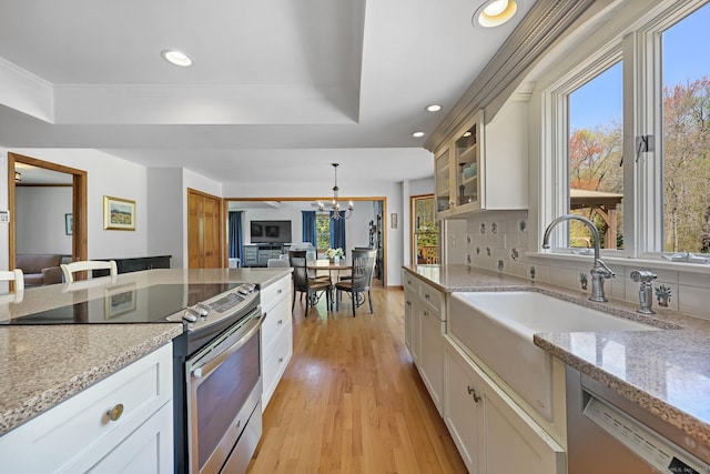 4 Walnut Ridge Rd, New Fairfield, CT 06812 - kitchen featuring a sink, a chandelier, a tray ceiling, and stainless steel appliances
