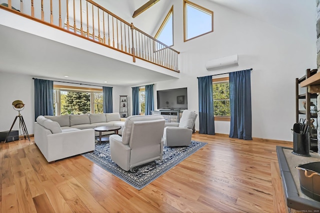 4 Walnut Ridge Rd, New Fairfield, CT 06812 - living area with an AC wall unit, wood finished floors, and a towering ceiling
