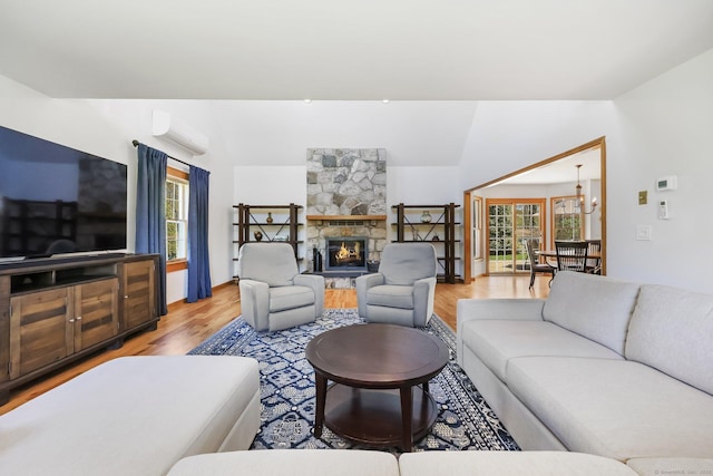 4 Walnut Ridge Rd, New Fairfield, CT 06812 - living room featuring an AC wall unit, light wood finished floors, and a wealth of natural light