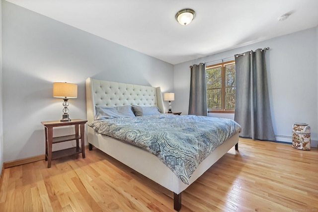 4 Walnut Ridge Rd, New Fairfield, CT 06812 - bedroom with baseboards, a baseboard heating unit, and light wood finished floors