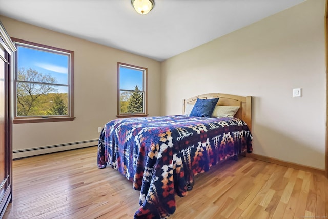 4 Walnut Ridge Rd, New Fairfield, CT 06812 - bedroom featuring baseboards, a baseboard heating unit, and hardwood / wood-style flooring