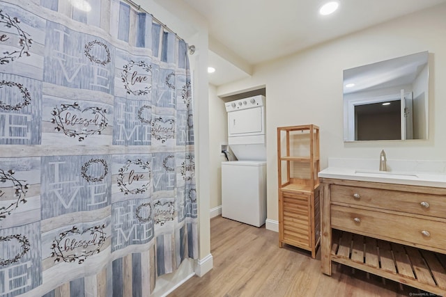 4 Walnut Ridge Rd, New Fairfield, CT 06812 - full bath with vanity, recessed lighting, baseboards, wood finished floors, and stacked washer and clothes dryer