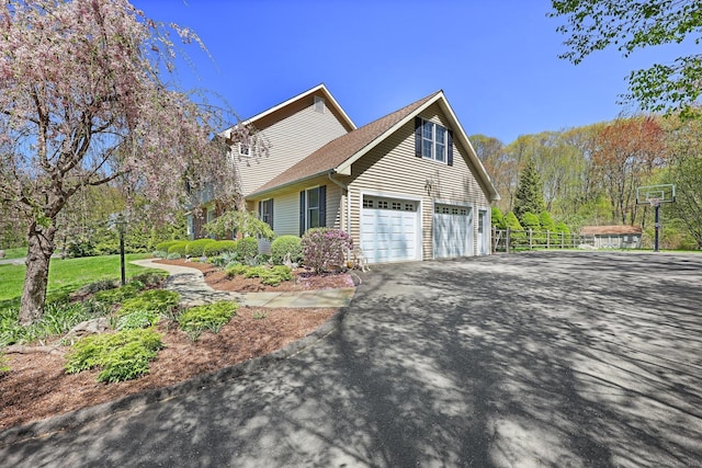 4 Walnut Ridge Rd, New Fairfield, CT 06812 - view of side of property featuring fence, driveway, and a garage