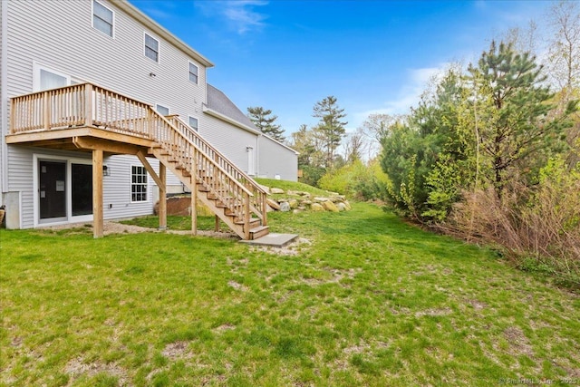 view of yard with a wooden deck and stairs