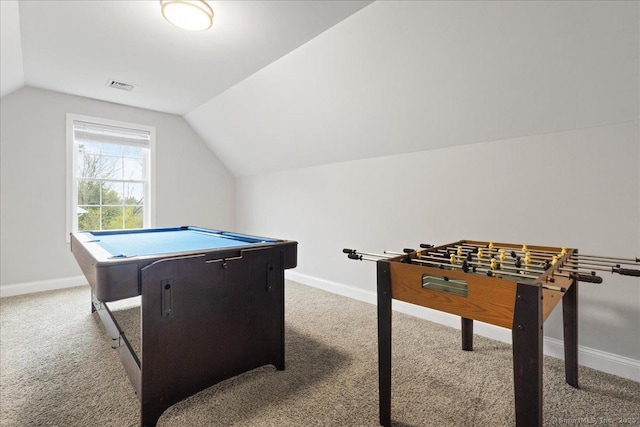 recreation room featuring baseboards, visible vents, carpet, and vaulted ceiling