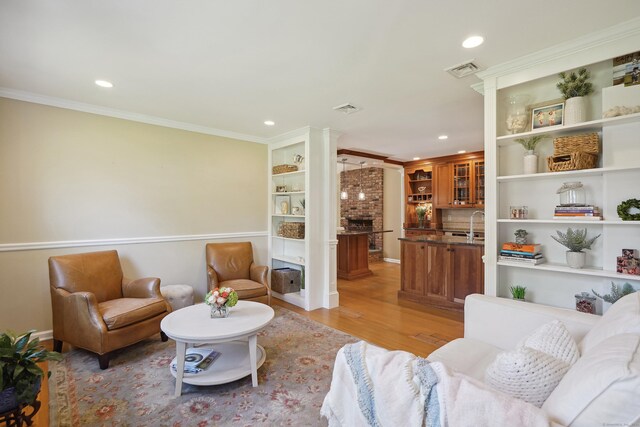 50 Carriage Dr S, Stamford, CT 06902 - living area featuring light wood-style floors, recessed lighting, and crown molding