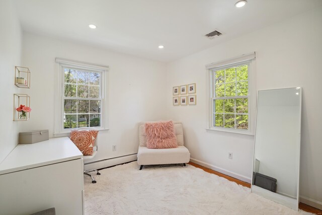 50 Carriage Dr S, Stamford, CT 06902 - home office featuring baseboard heating, healthy amount of natural light, recessed lighting, baseboards, and wood finished floors