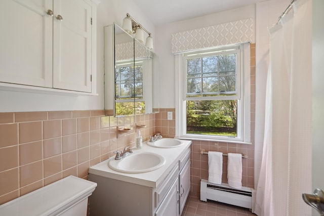50 Carriage Dr S, Stamford, CT 06902 - bathroom featuring a baseboard heating unit, tile walls, toilet, double vanity, and a shower with shower curtain