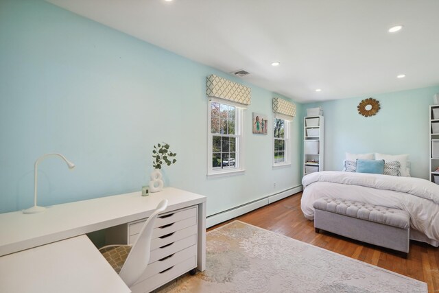 50 Carriage Dr S, Stamford, CT 06902 - bedroom featuring a baseboard radiator, wood finished floors, recessed lighting, and a desk