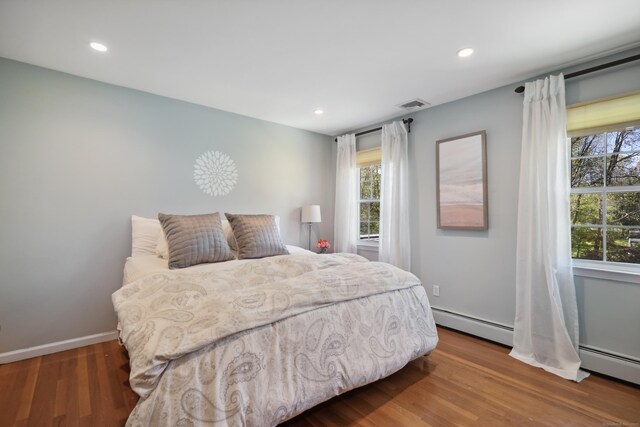 50 Carriage Dr S, Stamford, CT 06902 - bedroom featuring wood finished floors, recessed lighting, and baseboards