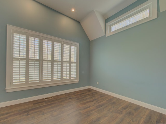 empty room featuring baseboards and wood finished floors
