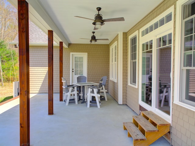 view of patio / terrace with a ceiling fan and outdoor dining space