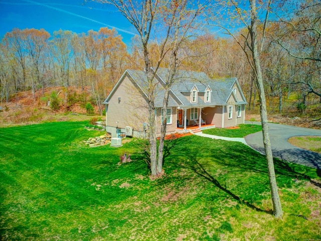 view of front facade with a porch and a front yard