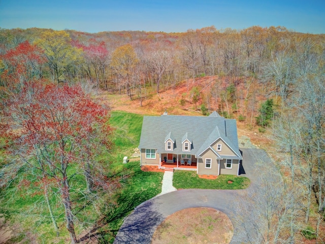 aerial view featuring a forest view