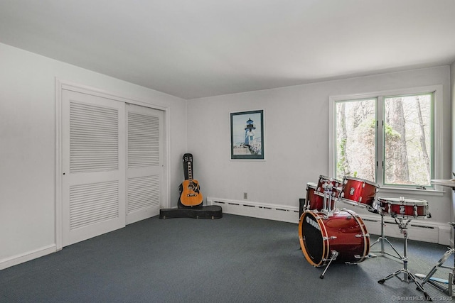 living area featuring carpet floors and baseboard heating