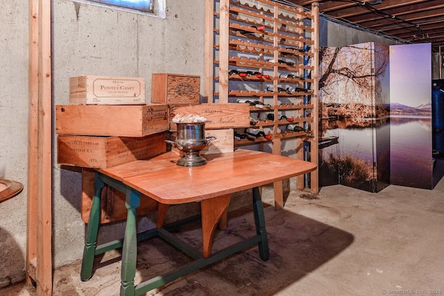 dining area featuring concrete flooring and a water view