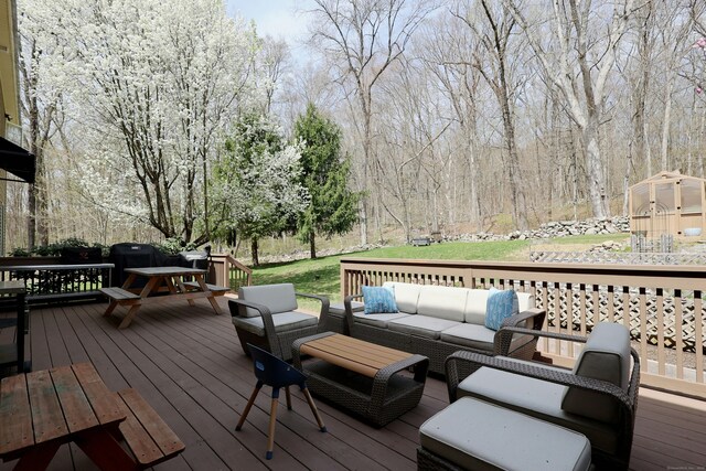 deck featuring an outdoor hangout area and outdoor dining area