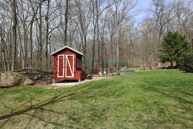 view of yard with exterior structure and an outdoor structure
