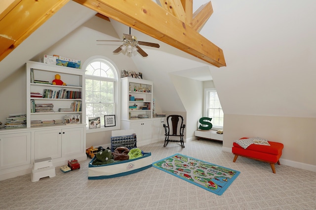 rec room featuring carpet flooring, a ceiling fan, and lofted ceiling with beams