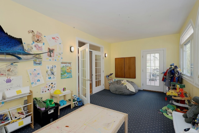 game room featuring carpet floors and french doors