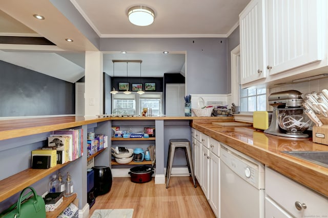 115 W Avon Rd, Farmington, CT 06085 - kitchen with crown molding, dishwasher, butcher block countertops, light wood-style flooring, and white cabinetry