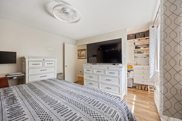 bedroom featuring light wood-style flooring
