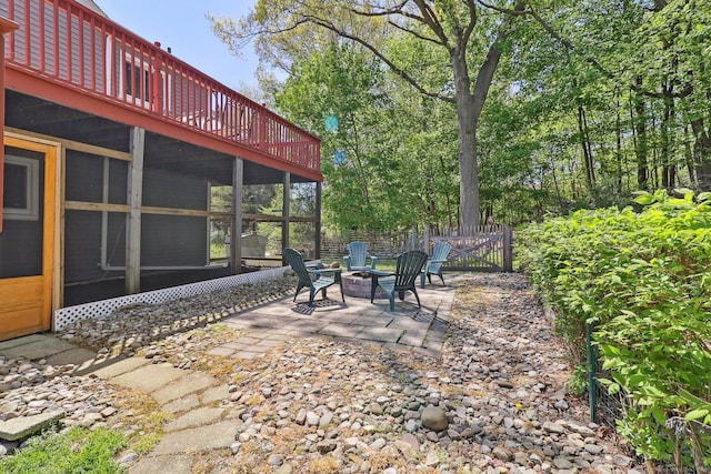 46 Fairway Grn, Fairfield, CT 06825 - view of patio featuring a sunroom, a fire pit, and fence
